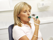 Dental patient using the green whistle (Penthrox).