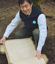 CSIRO Researcher Dr Malcolm Miao with the new weed biodegradable mat 