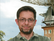 Dr Ettore Carretti standing in front of the Parkes telescope