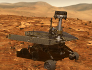 Mars rover robot on red soil with hills in the background.