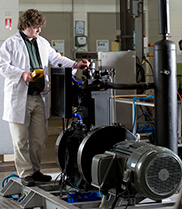 A researcher tests the Direct Injection Carbon Engine in the lab