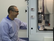 A researcher seated in front of scientific equipment at the Biosecure Immunology Laboratory