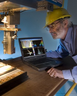 Jonathan Huntington examining one of the HyChips HyLogging machines with the CSIRO developed TSG software in the background