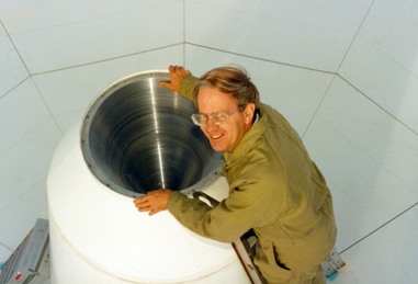Bruce Thomas inspecting the (large) corrugated-horn on an 18-m antenna prior to testing