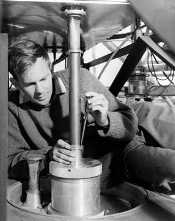 Bruce Thomas attaching a dual-hybrid-mode corrugated-horn in the focus cabin at the Parkes radio telescope in 1968