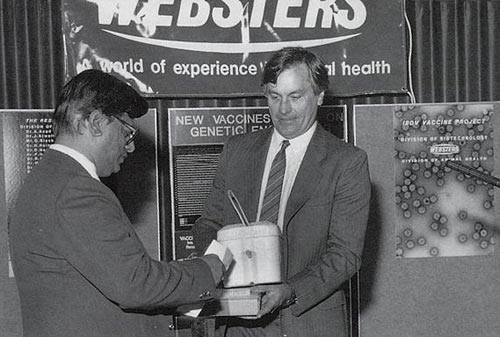 Ahmed Azad handing the IBDV vaccine vectors to Arthur Webster