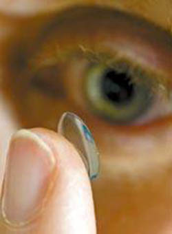 Contact lens on the end of a finger