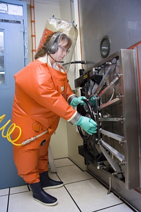 Staff inside CSIRO's Australian Animal Health Laboratory at Geelong