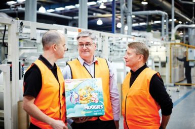 Andy Butler, Phil Butler and Dr Niall Finn standing in front of warehouse factory equipment at Textor’s Tullamarine premises in Victoria.