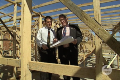 Researchers on building site.
