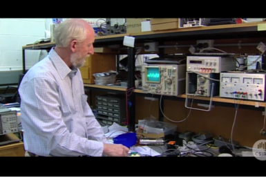 Keith Leslie at work in electronics laboratory.